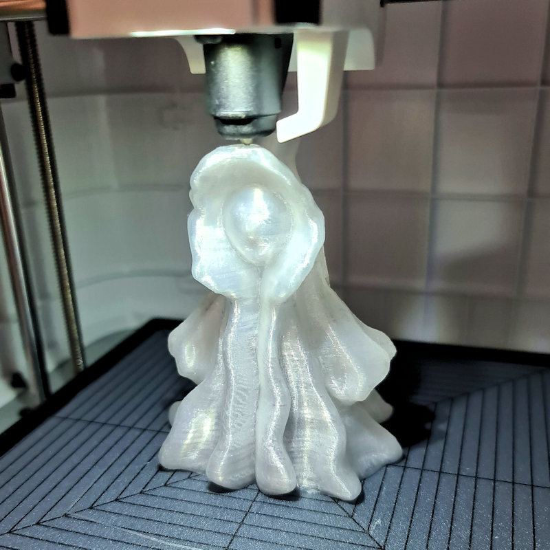 The spooky ghost being 3D printed.