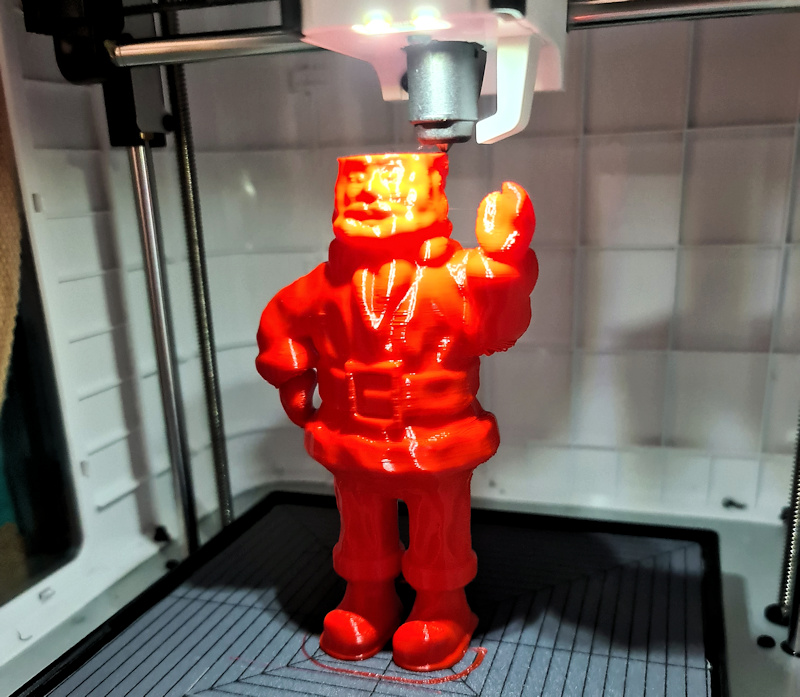 The mini Santa (Father Christmas) being 3D printed.
